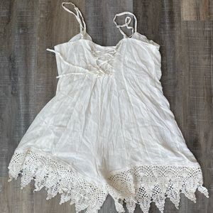 Lace back white romper with lace fringe!